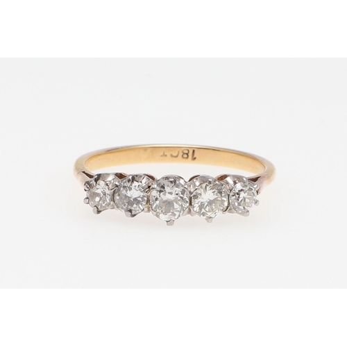 973 - A DIAMOND FIVE STONE RING. mounted with five graduated circular-cut diamonds, in 18ct gold, 2.8 gram... 