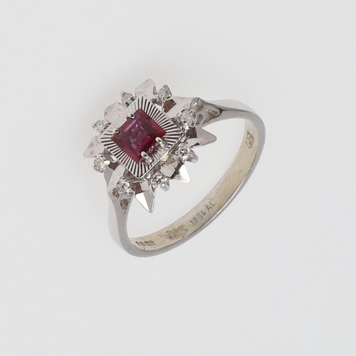 978 - A SPINEL AND DIAMOND CLUSTER RING. the square-shaped pink spinel is set within a surround of circula... 