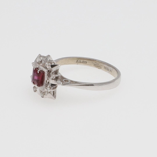 978 - A SPINEL AND DIAMOND CLUSTER RING. the square-shaped pink spinel is set within a surround of circula... 