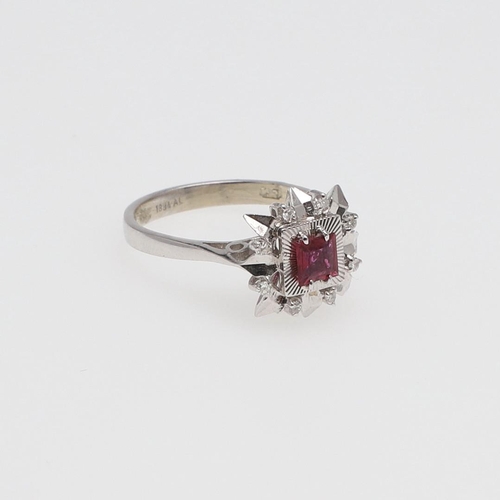 978 - A SPINEL AND DIAMOND CLUSTER RING. the square-shaped pink spinel is set within a surround of circula... 