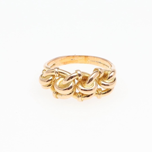 979 - AN 18CT GOLD TWIST RING. 5.7 grams. Size L.  *Condition:  A small repair to the shank, otherwise no ... 