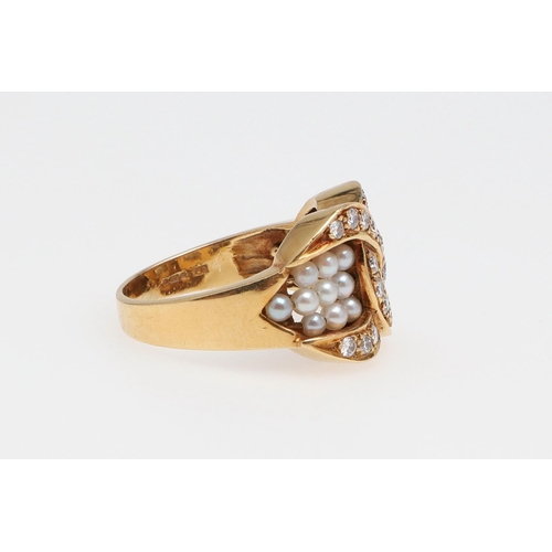 986 - A LATE 20TH CENTURY PEARL AND DIAMOND RING. the 18ct gold ring with two linked 'Cs' set with brillia... 