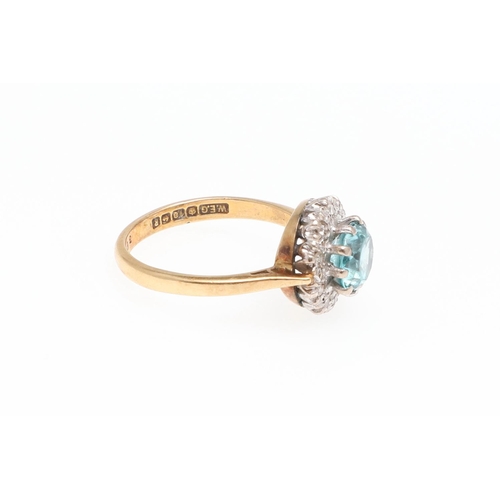 987 - A ZIRCON AND DIAMOND CLUSTER RING. the circular-cut zircon is set within a surround of circular-cut ... 