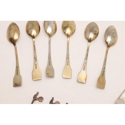 100 - THREE CASED SETS. a George V cased set of six silvergilt teaspoons, with beaded & enamelled terminal... 