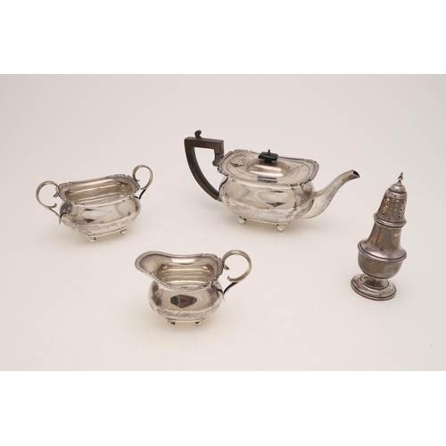 111 - A GEORGE V THREE-PIECE TEA SET. of rounded oblong form, with a tongue & dart border, scroll corners ... 