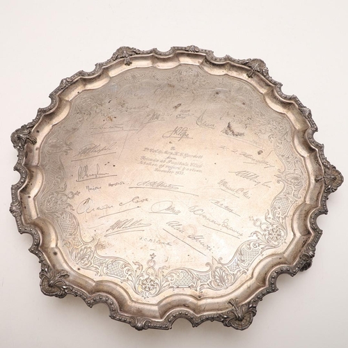 112 - A GEORGE V SALVER. of shaped circular outline, with an applied decorative border of beads, husks & s... 