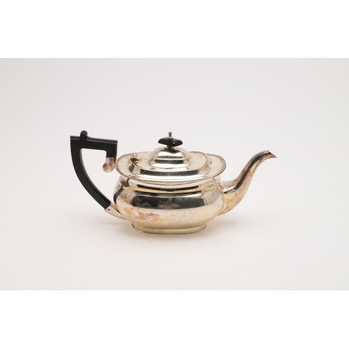 148 - A 20TH CENTURY TEAPOT. rounded oblong, with a gadrooned border, an ebonised angular handle & a cushi... 