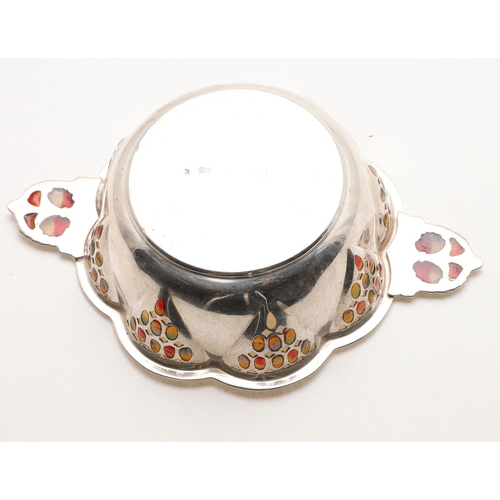 150 - A GEORGE V BONBON DISH. of polyfoil outline, with a bead border, the pierced sides & twin handles de... 