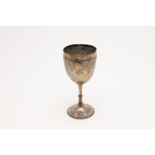 152 - A VICTORIAN WINE GOBLET. with punch-bead borders, embossed & chased decoration and on a pedestal foo... 