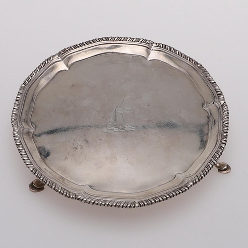 167 - A GEORGE III WAITER. of shaped circular outline, with a gadrooned border, engraved in the centre wit... 