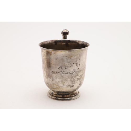 172 - A GEORGE V SCOTTISH CHRISTENING MUG. of campana form, with a leaf-capped flying scroll handle and in... 