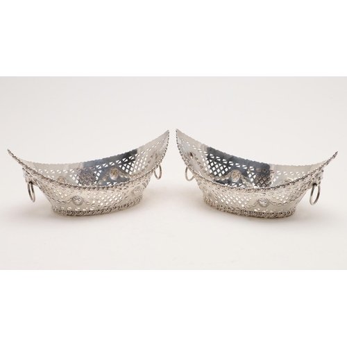 175 - A PAIR OF EDWARDIAN NAVETTE-SHAPED BASKETS. with gadrooned borders, pierced sides &  twin lion-mask ... 