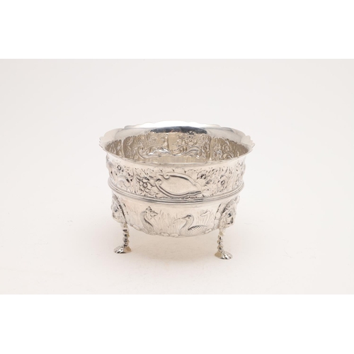 180 - A LATE VICTORIAN EMBOSSED BOWL. deep circular form, with a wavy rim, an applied central girdle, deco... 