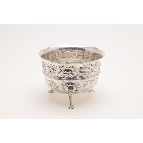 180 - A LATE VICTORIAN EMBOSSED BOWL. deep circular form, with a wavy rim, an applied central girdle, deco... 