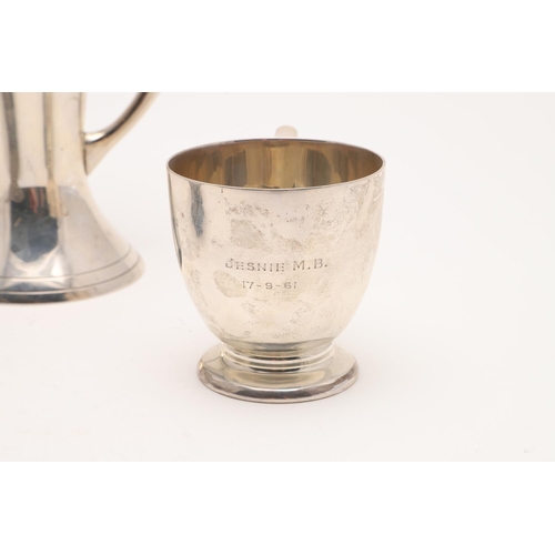 182 - A MODERN CHRISTENING MUG. circular form, with a 'C'-scroll handle and inscribed 