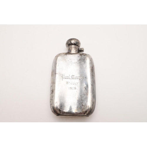 186 - A GEORGE V RECTANGULAR SPIRIT FLASK. with rounded corners, a hinged twist cap, crested & inscribed, ... 