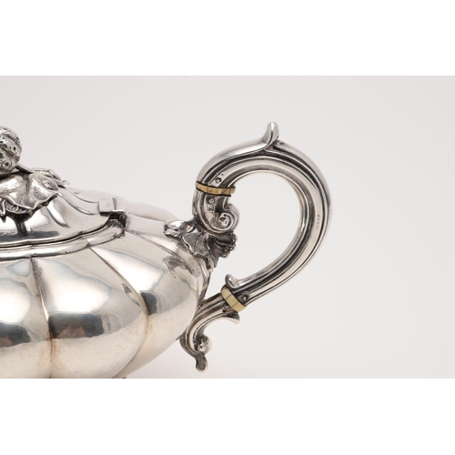 187 - A VICTORIAN IRISH TEA POT. of melon fluted form, with a strawberry finial, a 'C'-scroll handle and r... 