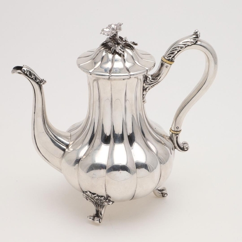 188 - AN EARLY VICTORIAN COFFEE POT. of baluster form, with vertical fluting, a leaf-capped  scroll handle... 