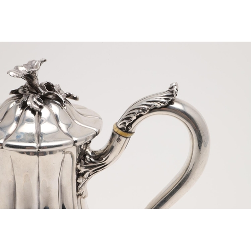 188 - AN EARLY VICTORIAN COFFEE POT. of baluster form, with vertical fluting, a leaf-capped  scroll handle... 