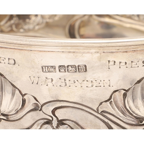 207 - AN EDWARDIAN ART-NOUVEAU ROSE BOWL. circular outline, decorated in relief with stylised flowers, wit... 