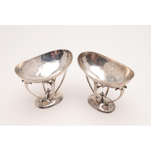 209 - A PAIR OF EDWARDIAN ART-NOUVEAU DISHES OR BASKETS. with oval bowls on four scrolling arms, spot-hamm... 