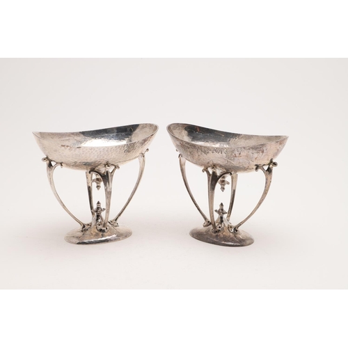 209 - A PAIR OF EDWARDIAN ART-NOUVEAU DISHES OR BASKETS. with oval bowls on four scrolling arms, spot-hamm... 