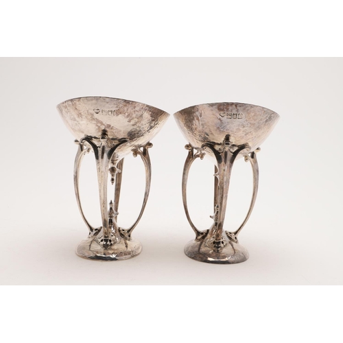 209 - A PAIR OF EDWARDIAN ART-NOUVEAU DISHES OR BASKETS. with oval bowls on four scrolling arms, spot-hamm... 