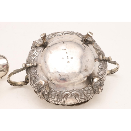 219 - A WILLIAM IV IRISH TWO-HANDLED SUGAR BOWL & MATCHING MILK JUG. squat circular form, with applied fol... 