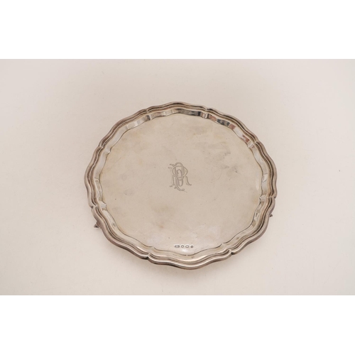 226 - A 20TH CENTURY SALVER. of shaped circular outline, with a moulded border, monogrammed in the centre ... 