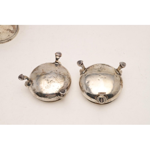 232 - A PAIR OF LATE GEORGE II CIRCULAR SALTS. with textured rims and on three legs, initialled, by Edward... 