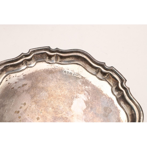 234 - A LATE 19TH/ EARLY 20TH CENTURY SMALL SALVER OR WAITER. shaped circular outline, with a moulded bord... 