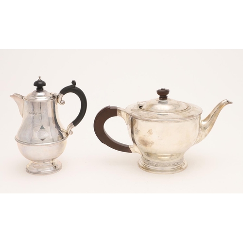 238 - A GEORGE VI CIRCULAR TEAPOT. with a scroll handle, a turned finial and a 