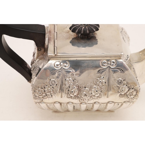 242 - A VICTORIAN THREE-PIECE TEA SET. of rectangular cushion form, with fluted lower bodies and embossed ... 