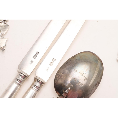 25 - CONTINENTAL/ FOREIGN FLATWARE & CUTLERY:-. a pair of knives, a serving slice and 7 various spoons, m... 