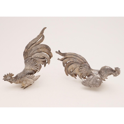 269 - A PAIR OF CONTINENTAL PARCELGILT TABLE DECORATIONS. in the form of fighting cocks, with English impo... 