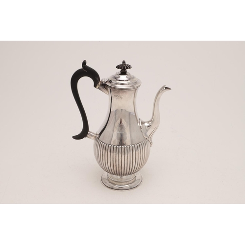 271 - A VICTORIAN BALUSTER COFFEE POT. with a fluted lower body, a scroll handle and a spreading circular ... 