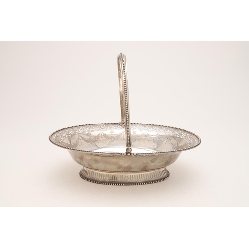 274 - A GEORGE III SWING-HANDLE CAKE BASKET. oval outline, with bead borders, the edges and foot with pier... 