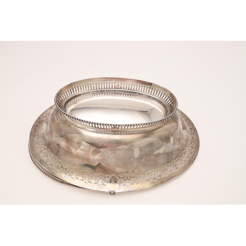 274 - A GEORGE III SWING-HANDLE CAKE BASKET. oval outline, with bead borders, the edges and foot with pier... 