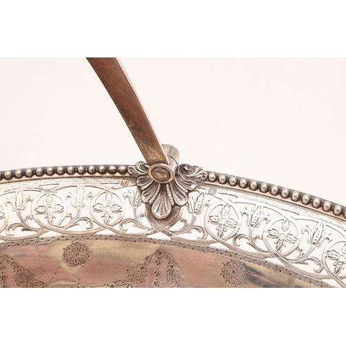 274 - A GEORGE III SWING-HANDLE CAKE BASKET. oval outline, with bead borders, the edges and foot with pier... 