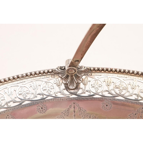 274 - A GEORGE III SWING-HANDLE CAKE BASKET. oval outline, with bead borders, the edges and foot with pier... 