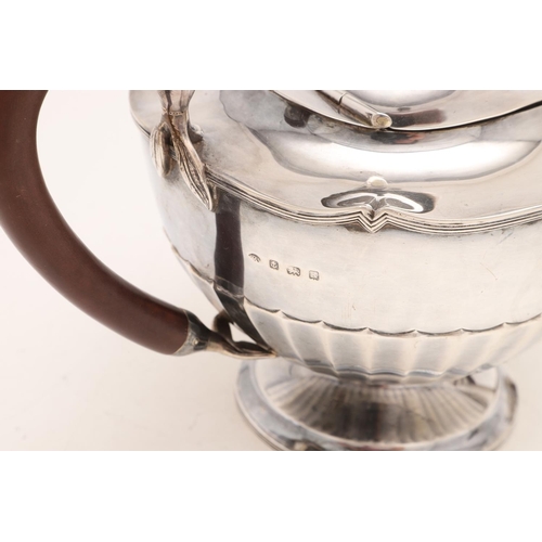 275 - A GEORGE V TEAPOT & MATCHING HOT WATER JUG. circular form, with fluted lower bodies, reeded borders ... 