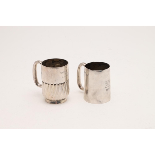 280 - TWO 20TH CENTURY SILVER MUGS. one with a fluted lower body and a collet foot, by William Hutton & So... 