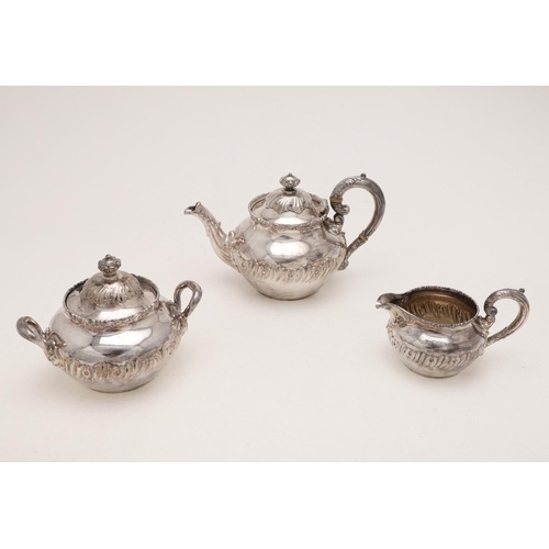 282 - A LATE 19TH/ EARLY 20TH CENTURY NORTH AMERICAN THREE-PIECE TEA SET. circular form, with embossed dec... 