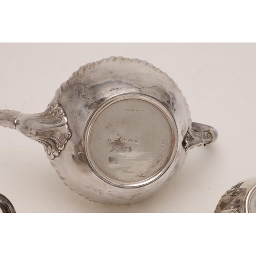 282 - A LATE 19TH/ EARLY 20TH CENTURY NORTH AMERICAN THREE-PIECE TEA SET. circular form, with embossed dec... 