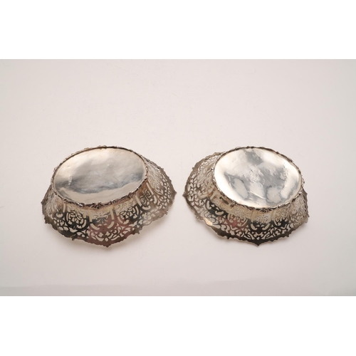 284 - A PAIR OF EDWARDIAN BASKETS. oval outline, with pierced sides and foliate scroll borders, by William... 