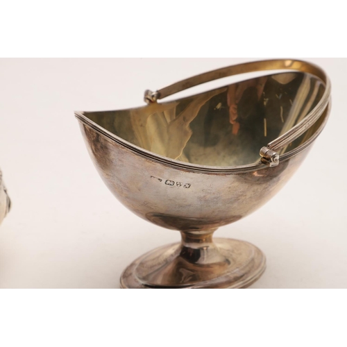 290 - AN EDWARDIAN ART-NOUVEAU SWING-HANDLE BOWL. shallow circular form, with embossed motifs, a spot hamm... 