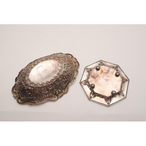 291 - A VICTORIAN EMBOSSED BONBON DISH. shaped oval outline, with a scroll border and engraved in the cent... 