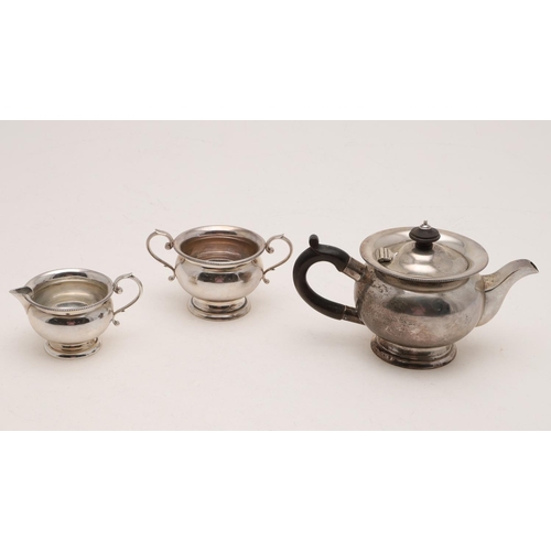 294 - AN EDWARDIAN THREE-PIECE BACHELOR'S TEA SET. circular form, with bead borders & scroll handles, by H... 