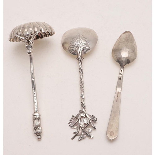 32 - A MODERN NATURALISTIC SPOON. with a birds nest finial, a twisted stem and engraved flowers to the bo... 