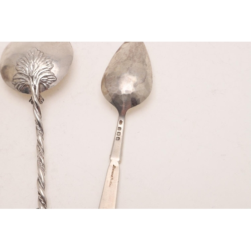 32 - A MODERN NATURALISTIC SPOON. with a birds nest finial, a twisted stem and engraved flowers to the bo... 